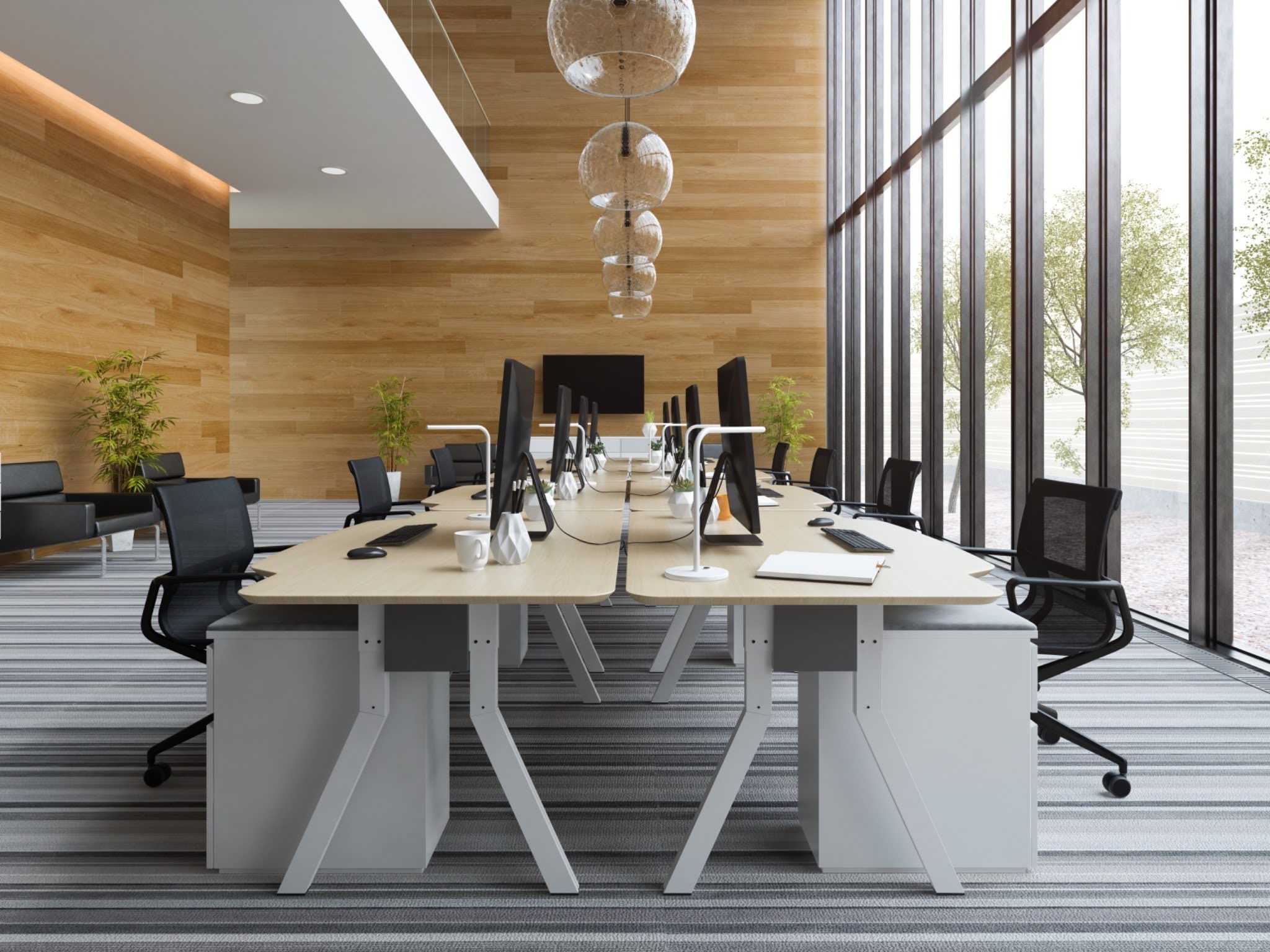Modern open-plan office with wooden slat wall and modular workstations