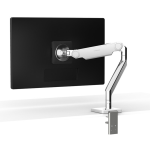 The white Humanscale M2.1 monitor arm attached to the back of a black computer monitor