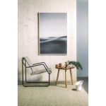 Yeseco Still T acoustic panel, featuring a printed black and white abstract landscape, hung as wall art in a modern room