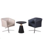 Two Honde swivel armchairs, one white and one blue, with a small black table