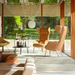 Two tan Tarry lounge chairs in a room