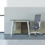 A modern office setting featuring the Surface midback chair with a light grey frame and grey mesh upholstery